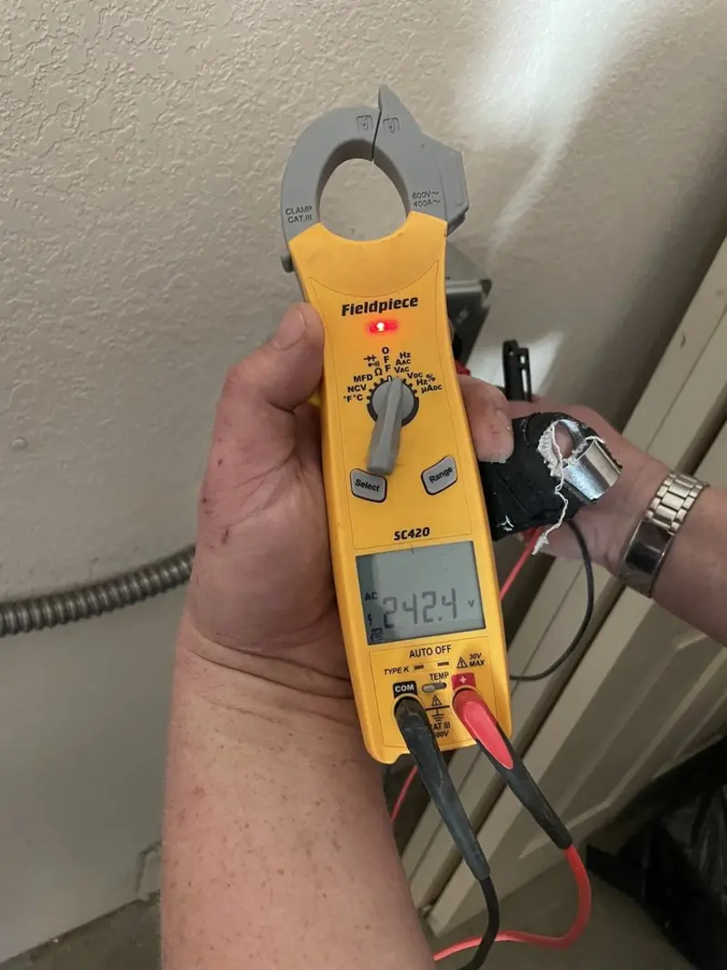 Voltage testing with clamp meter during Recessed Lighting Installation in Waynesboro